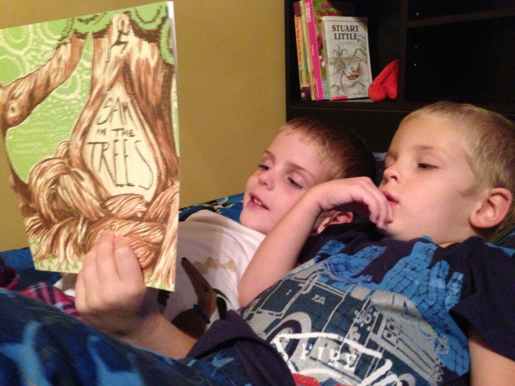 Boys reading Sam in the Trees